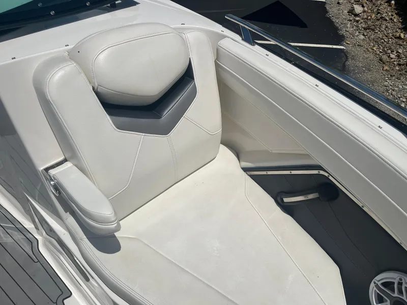 Slide: The Image of White leather seat on 2014 Monterey 268SS Bowrider boat, featuring sleek design and armrest. - 17