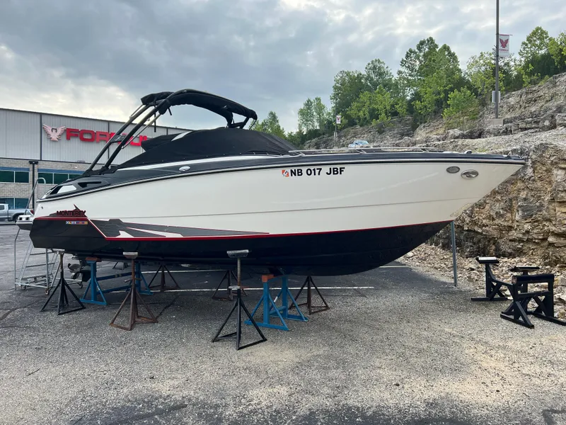 Slide: The Image of 2014 Monterey 268SS Bowrider boat on stands, outdoor dealership setting. - 20