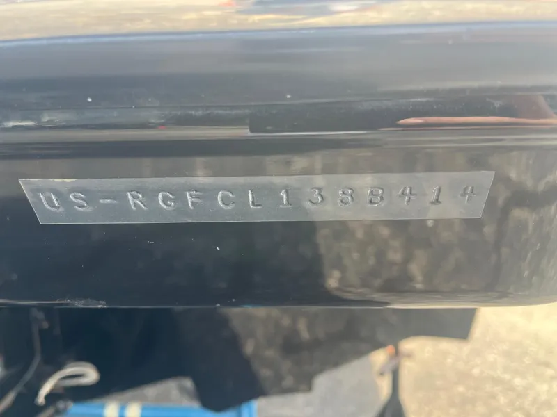 Slide: The Image of 2014 Monterey 268SS Bowrider hull identification number on black surface. - 4