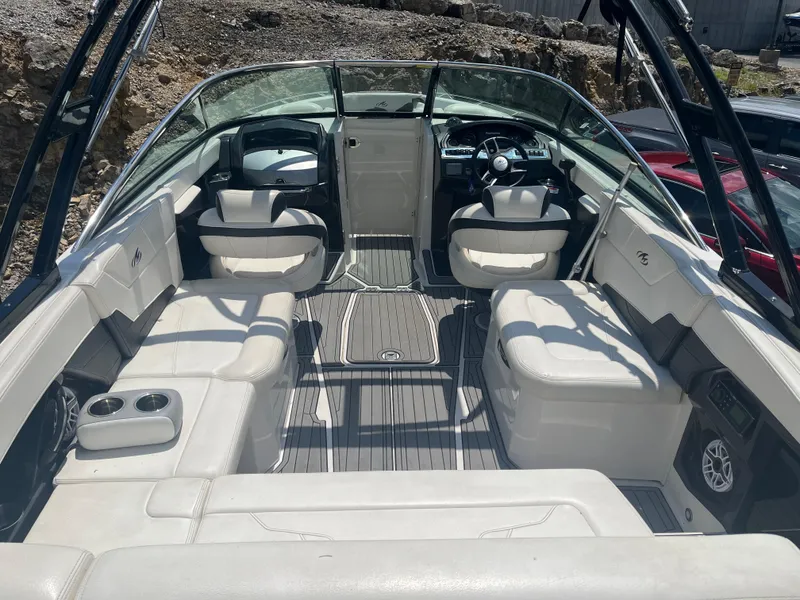 Slide: The Image of 2014 Monterey 268SS Bowrider interior with white seating and modern dashboard. - 5