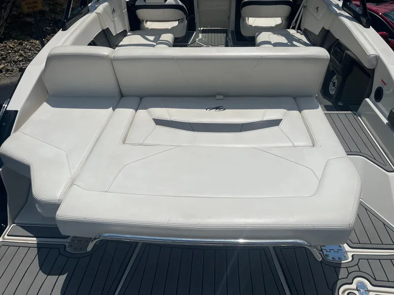 Slide: The Image of 2014 Monterey 268SS Bowrider boat interior with white seating and sleek design. - 6