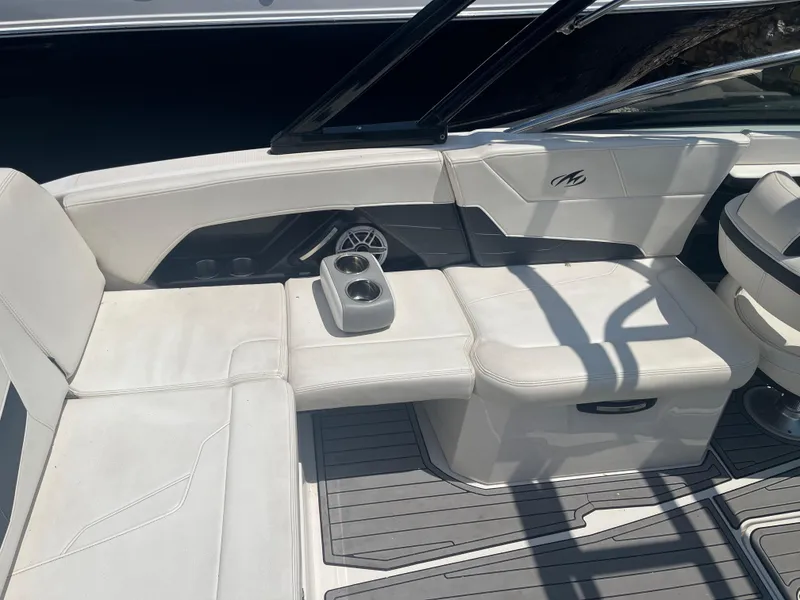 Slide: The Image of 2014 Monterey 268SS Bowrider interior with white seating and cup holders. - 7