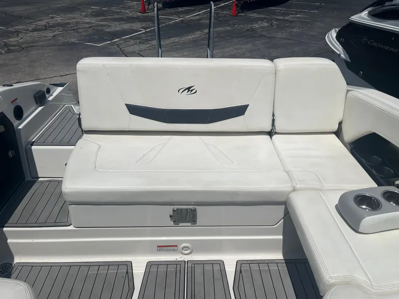 Slide: The Image of 2014 Monterey 268SS Bowrider boat interior with white seating and cup holders. - 8