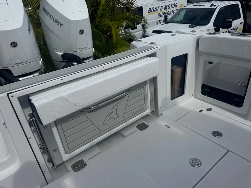 Slide: The Image of 2026 Blackfin 302 CC boat with Mercury engines, featuring a sleek deck and storage compartments. - 16
