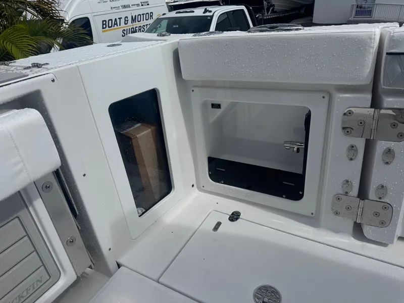 Slide: The Image of 2026 Blackfin 302 CC boat interior with storage compartments and sleek design. - 18