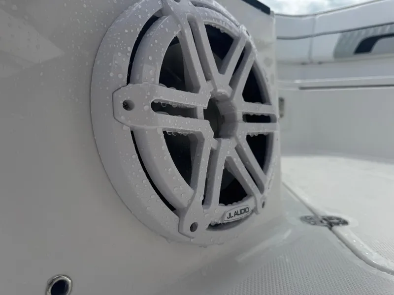 Slide: The Image of Close-up of JL Audio speaker on 2026 Blackfin 302 CC boat, with water droplets. - 29