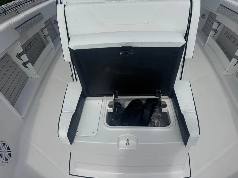 Slide: The Image of 2026 Blackfin 302 CC boat with open storage compartment on deck. - 34