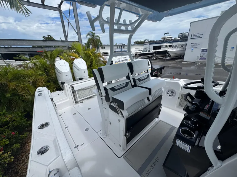 Slide: The Image of 2026 Blackfin 302 CC boat interior with dual seats and modern controls. - 36