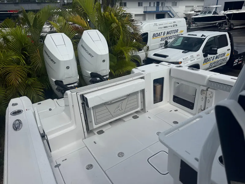 Slide: The Image of 2026 Blackfin 302 CC boat with twin Mercury engines at dealership. - 40