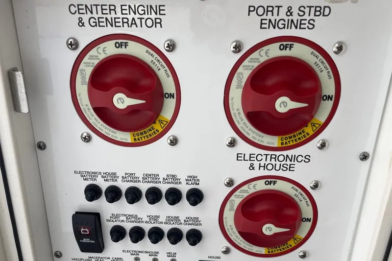 Slide: The Image of Control panel of a 2021 Pursuit OS 385 Offshore boat with engine and electronics switches. - 27