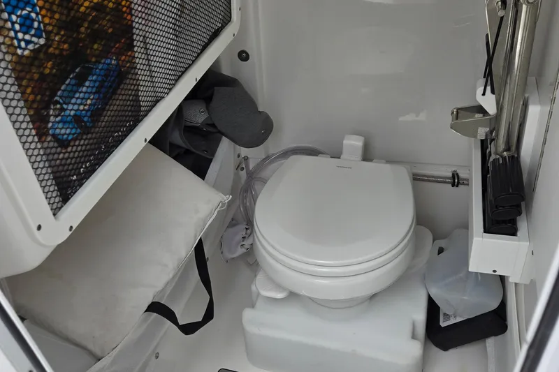 Slide: The Image of Interior of 2022 Sea Hunt Ultra 265 SE boat with compact marine toilet. - 20