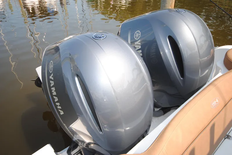 Slide: The Image of Twin Yamaha outboard engines on a 2022 Sea Hunt Ultra 265 SE boat. - 21