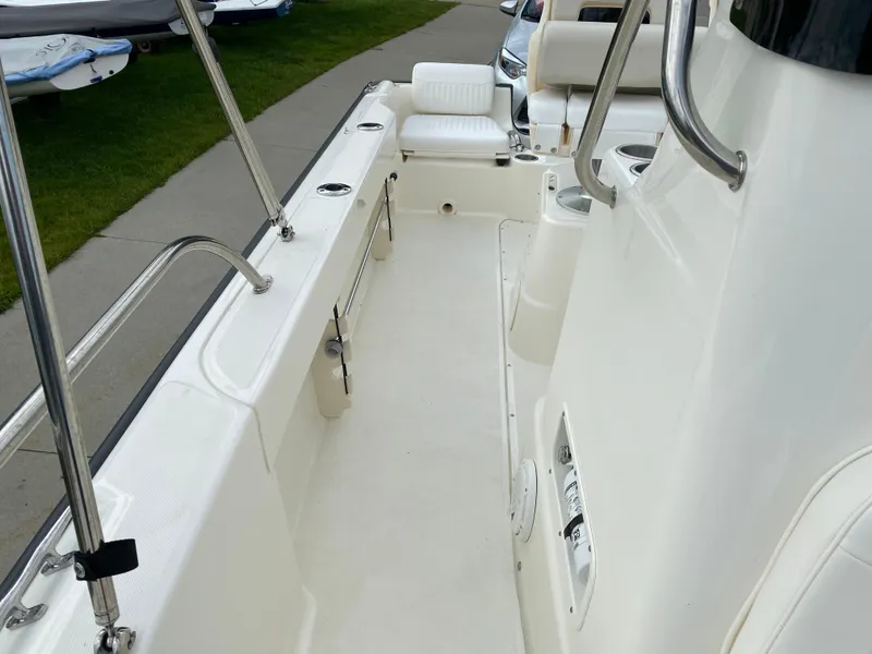 Slide: The Image of 2021 Boston Whaler 190 Outrage boat interior with seating and stainless steel railings. - 16