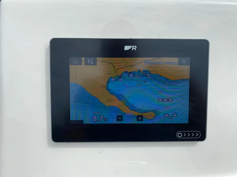 Slide: The Image of Navigation display on a 2021 Boston Whaler 190 Outrage showing marine chart and depth. - 21