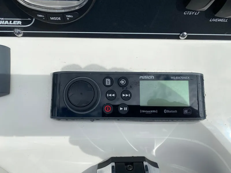 Slide: The Image of Fusion MS-RA70NSX audio system on 2021 Boston Whaler 190 Outrage boat dashboard. - 22