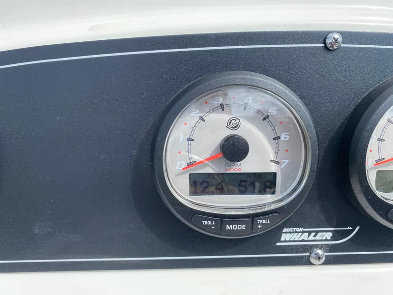 Slide: The Image of Close-up of 2021 Boston Whaler 190 Outrage boat tachometer displaying RPM and hours. - 23