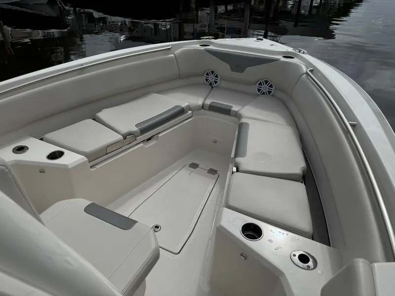Slide: The Image of 2025 Sailfish 232 CC boat dashboard with navigation screens and steering wheel. - 9
