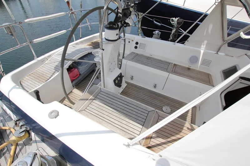 Slide: The Image of Cockpit of 1997 Nautor Swan 48 yacht with teak flooring and steering wheel. - 13