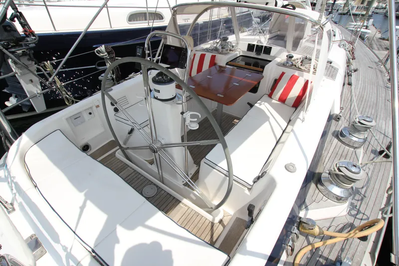 Slide: The Image of Cockpit of 1997 Nautor Swan 48 yacht with steering wheel and seating area. - 18