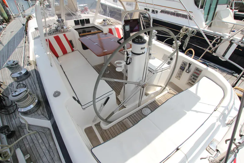 Slide: The Image of Cockpit of 1997 Nautor Swan 48 yacht with steering wheel and seating area. - 19