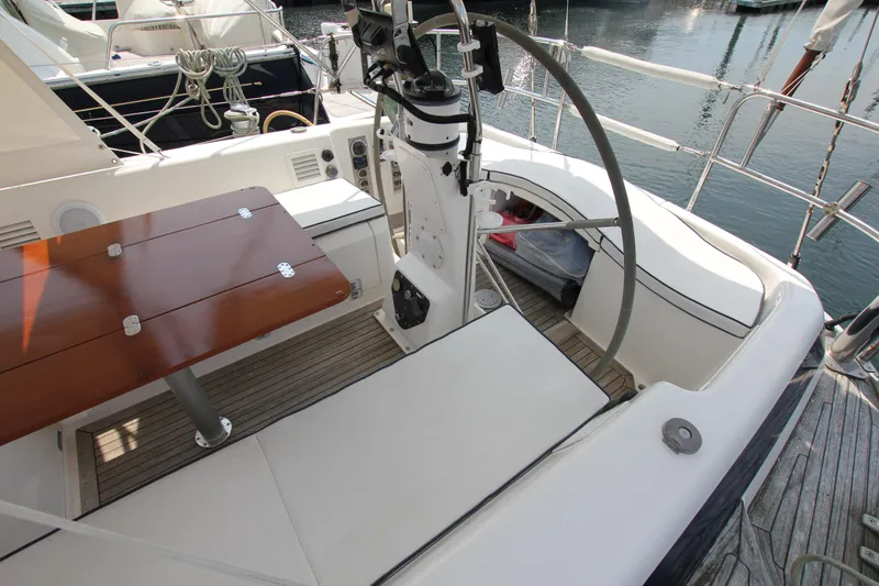 Slide: The Image of Cockpit of 1997 Nautor Swan 48 yacht with wooden table and steering wheel. - 20
