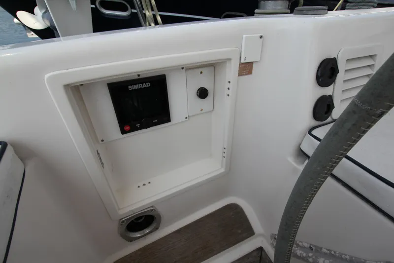 Slide: The Image of Control panel on a 1997 Nautor Swan 48 yacht, featuring a Simrad display. - 23