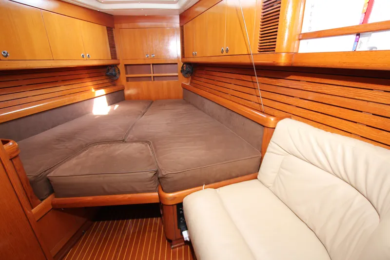 Slide: The Image of Luxurious cabin interior of 1997 Nautor Swan 48 yacht with wooden finish and comfortable seating. - 25