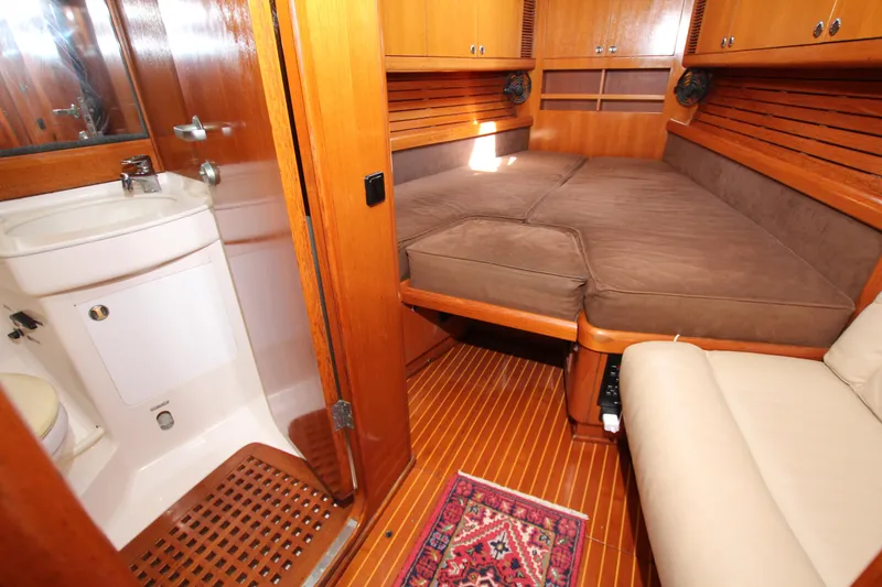 Slide: The Image of Interior of 1997 Nautor Swan 48 yacht with cozy cabin and compact bathroom. - 27
