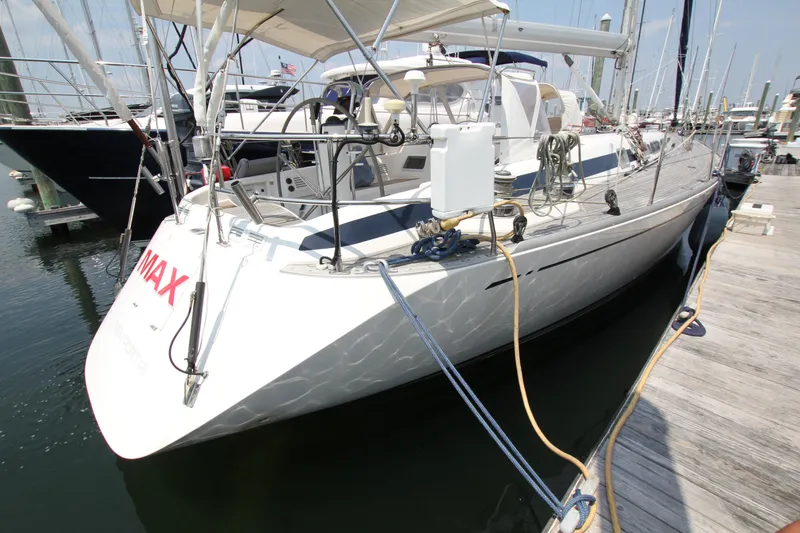 Slide: The Image of Nautor Swan 48 yacht, 1997 model, docked at marina with visible deck and rigging. - 3