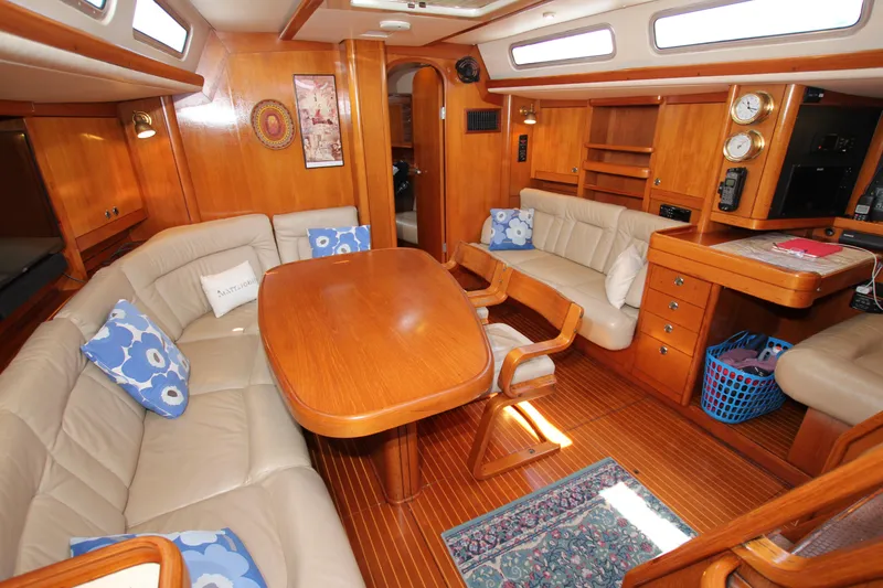 Slide: The Image of Luxurious 1997 Nautor Swan 48 yacht interior with wooden furnishings and plush seating. - 30