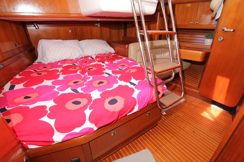 Slide: The Image of Cozy cabin interior of 1997 Nautor Swan 48 yacht with vibrant floral bedding. - 37