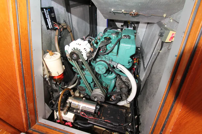 Slide: The Image of Engine compartment of a 1997 Nautor Swan 48 sailboat, showcasing mechanical components. - 38