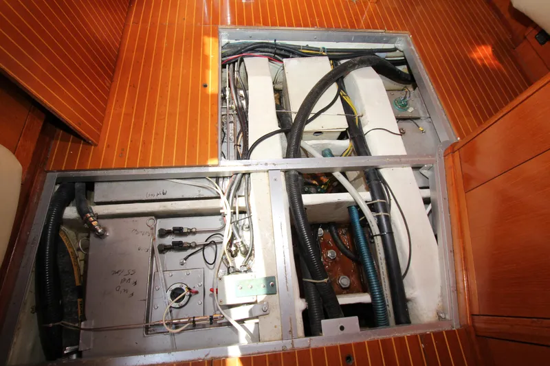 Slide: The Image of Engine compartment of a 1997 Nautor Swan 48 yacht, showcasing wiring and components. - 41