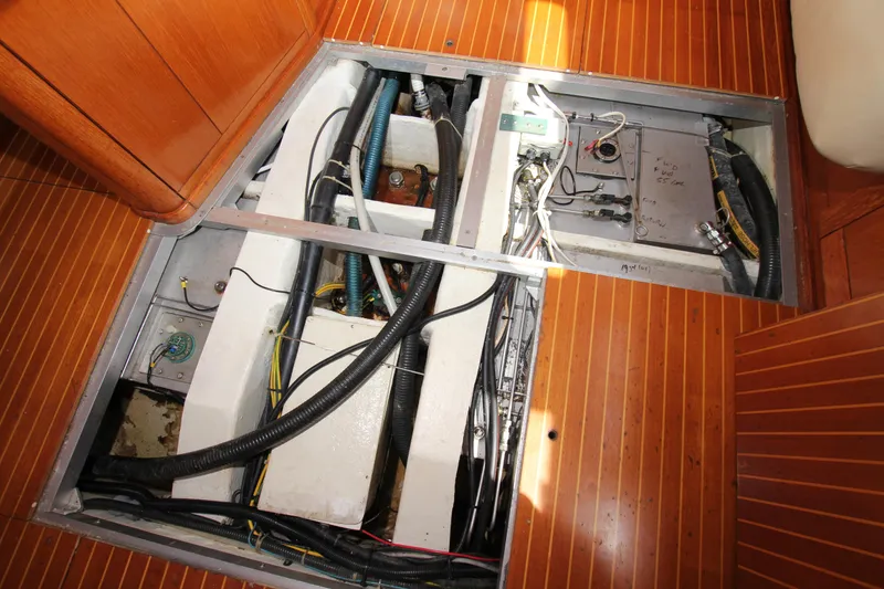 Slide: The Image of Engine compartment of 1997 Nautor Swan 48 yacht with visible wiring and components. - 42