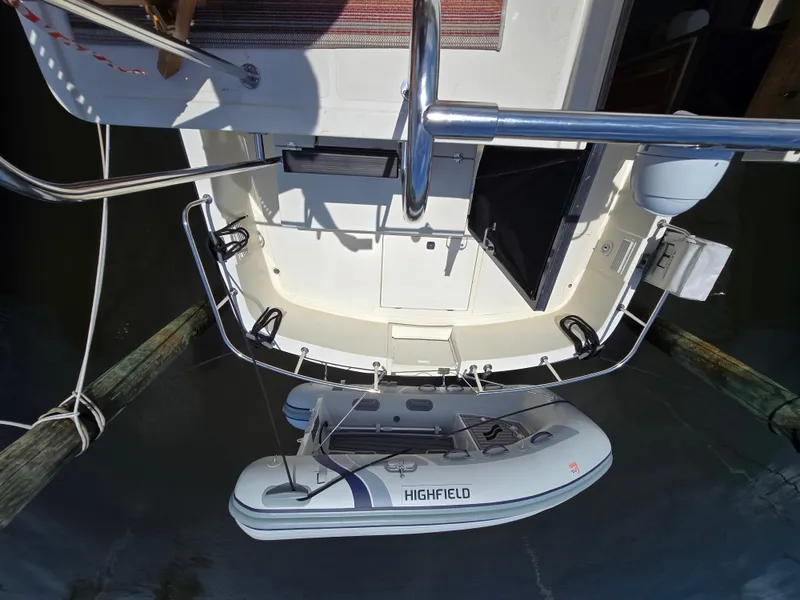 Slide: The Image of Nordic Tug 32 (2001) with a Highfield inflatable boat attached at the stern. - 19