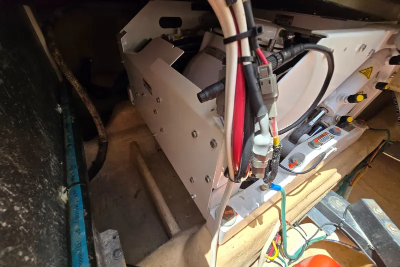 Slide: The Image of Engine compartment of a 2001 Nordic Tug 32, showcasing wiring and mechanical components. - 29