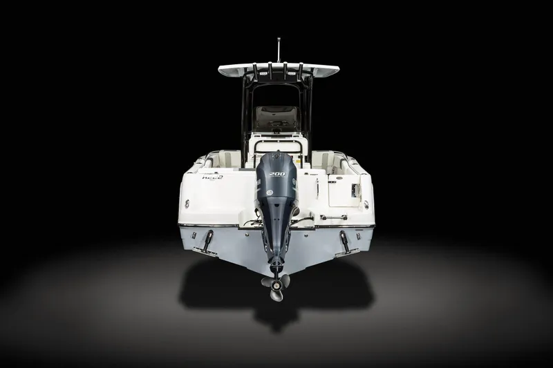 Slide: The Image of Manufacturer Provided Image: 2025 Robalo R222 Center Console boat, rear view, showcasing sleek design and powerful engine. - 9