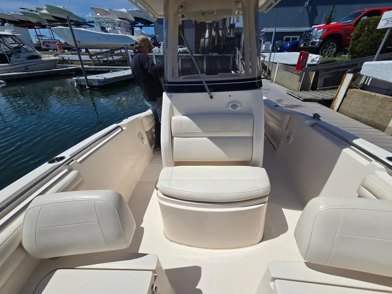 Slide: The Image of 2019 Grady-White Fisherman 216 boat interior with seating, docked at marina. - 15