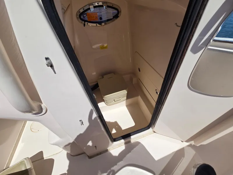Slide: The Image of 2019 Grady-White Fisherman 216 boat interior with compact marine toilet. - 16