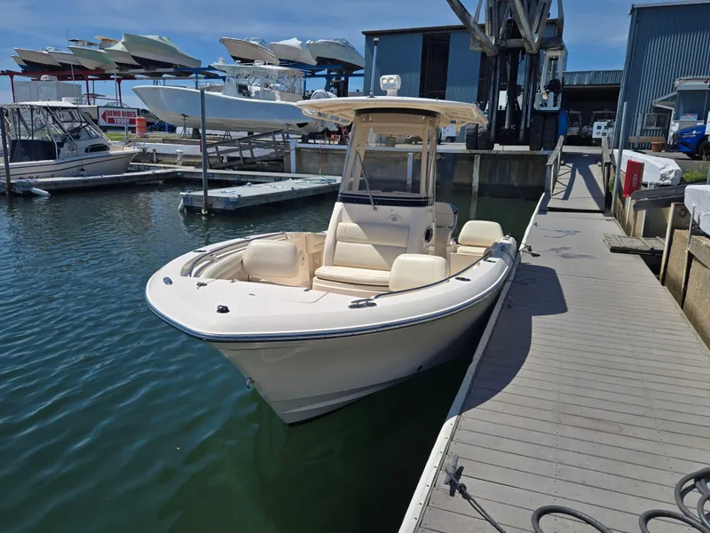 Slide: The Image of 2019 Grady-White Fisherman 216 boat docked at marina, surrounded by other vessels. - 3