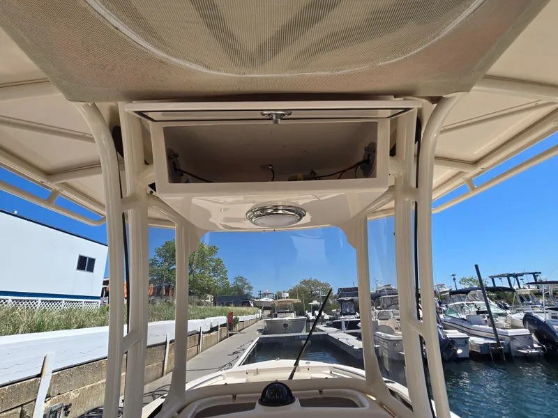 Slide: The Image of 2019 Grady-White Fisherman 216 boat interior view at marina. - 7
