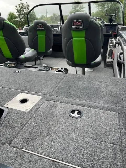 Slide: The Image of 2023 Ranger VX1888 WT boat interior with green-accented seats and carpeted flooring. - 3