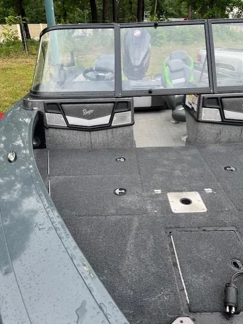 Slide: The Image of 2023 Ranger VX1888 WT boat interior with windshield, seats, and carpeted deck. - 4