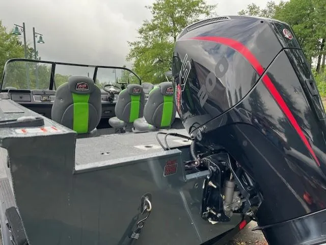 Slide: The Image of 2023 Ranger VX1888 WT boat with powerful outboard motor and green-accented seats. - 7