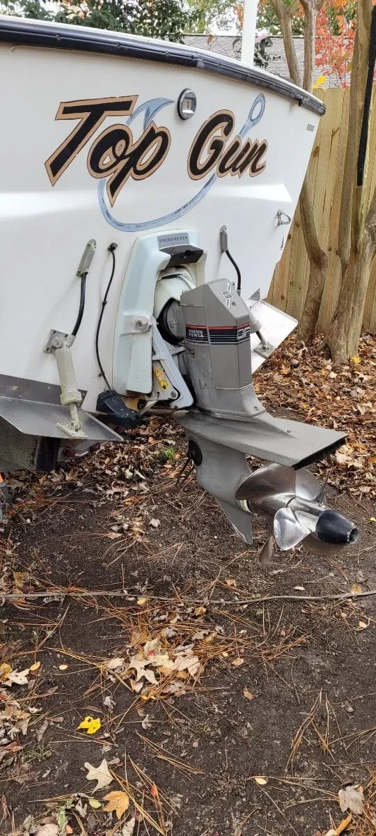 Slide: The Image of 1986 Albemarle 24 Cuddy boat stern with "Top Gun" lettering and outboard motor. - 6