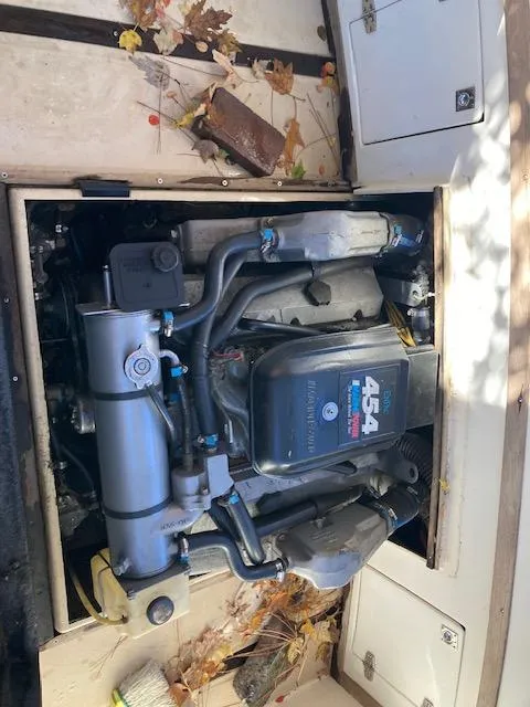 Slide: The Image of 1986 Albemarle 24 Cuddy engine compartment with visible 454 engine. - 5