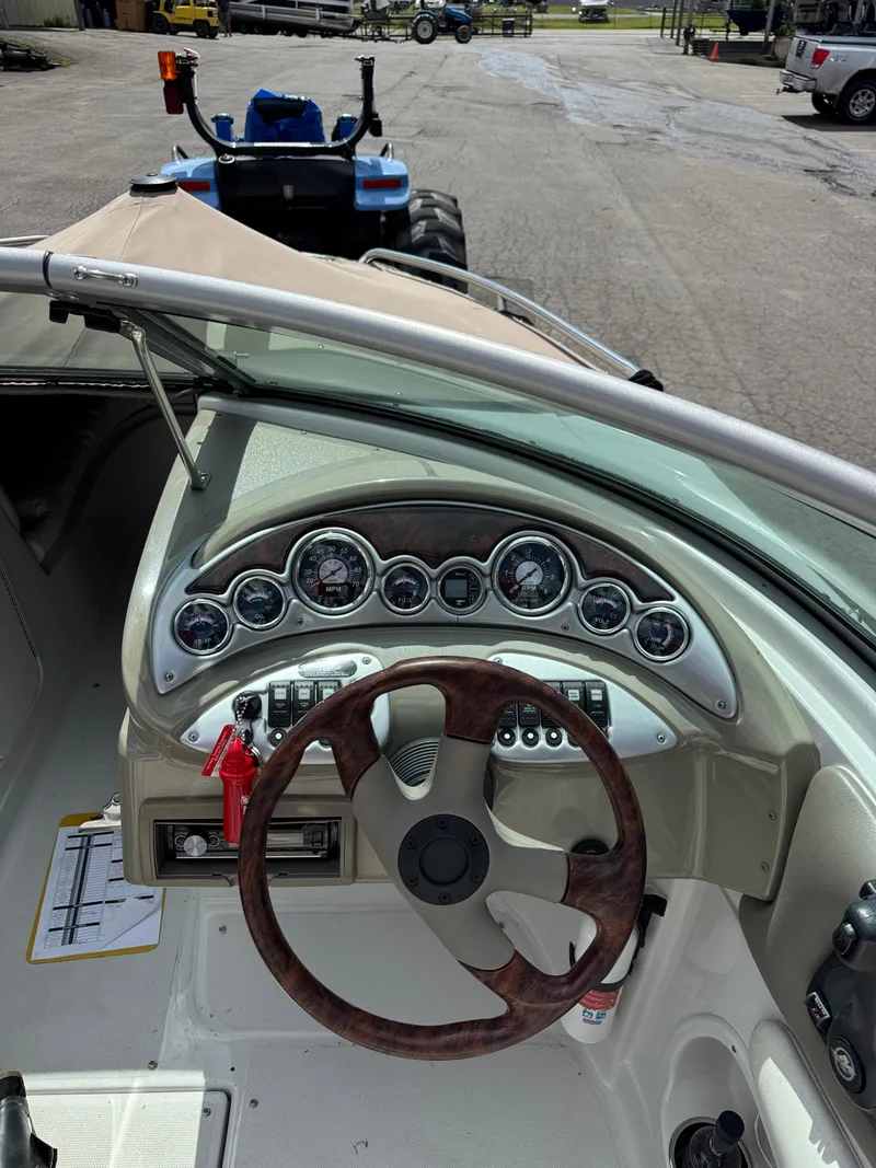 Slide: The Image of 2008 Crownline 220 LS boat dashboard with steering wheel and instrument panel. - 6