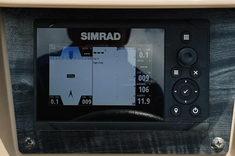 Slide: The Image of Simrad marine display on 2022 Starcraft LX22 boat dashboard, showing navigation and depth data. - 18