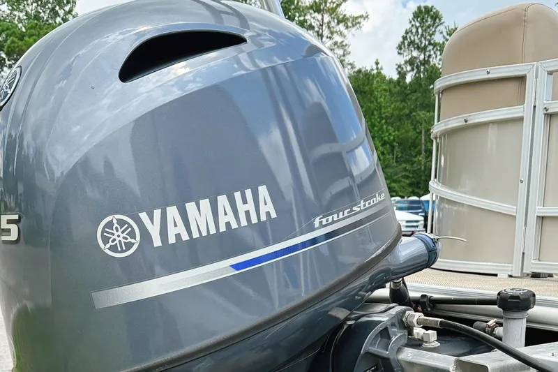 Slide: The Image of Yamaha four-stroke outboard motor on 2022 Starcraft LX22 boat, outdoor setting. - 8