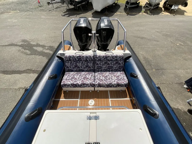 Slide: The Image of 2019 Protector 310 Chase boat with dual engines and patterned seating. - 27